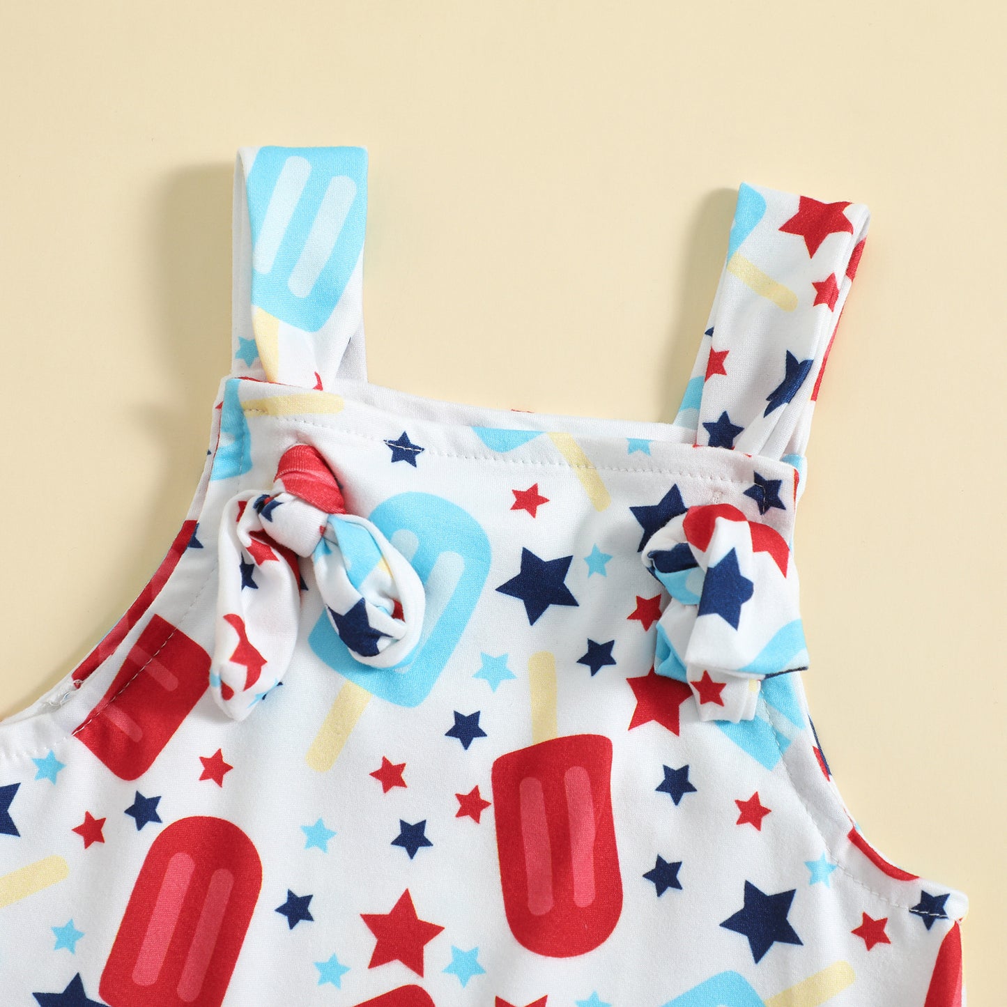 Playful Printed Suspender Baby Romper – Knot Front Detail